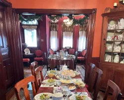 A dining table set for a formal meal.